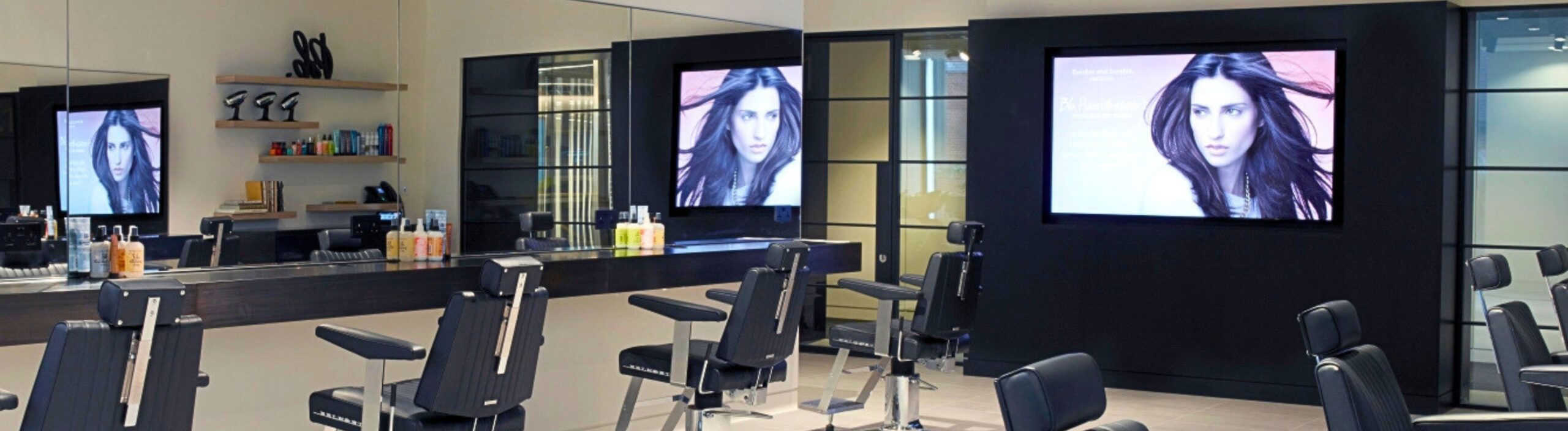 Salon with dividers separating the waiting room. 