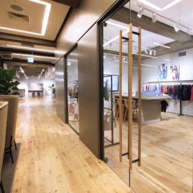 Project: International Fashion Wholesaler | Products: Optima 117 Plus single glazed partitions with Axile Clarity doors and bespoke timber handles