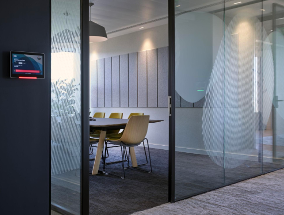 an office space using privacy glass as a modern glass partition