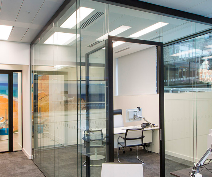 modular office space with glass wall partitions