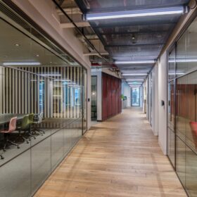 Project: Multinational Music Company | Products: Revolution 54 Plus Shoreditch Edition and Optima 117 Plus glass partitions with Edge Symmetry doors