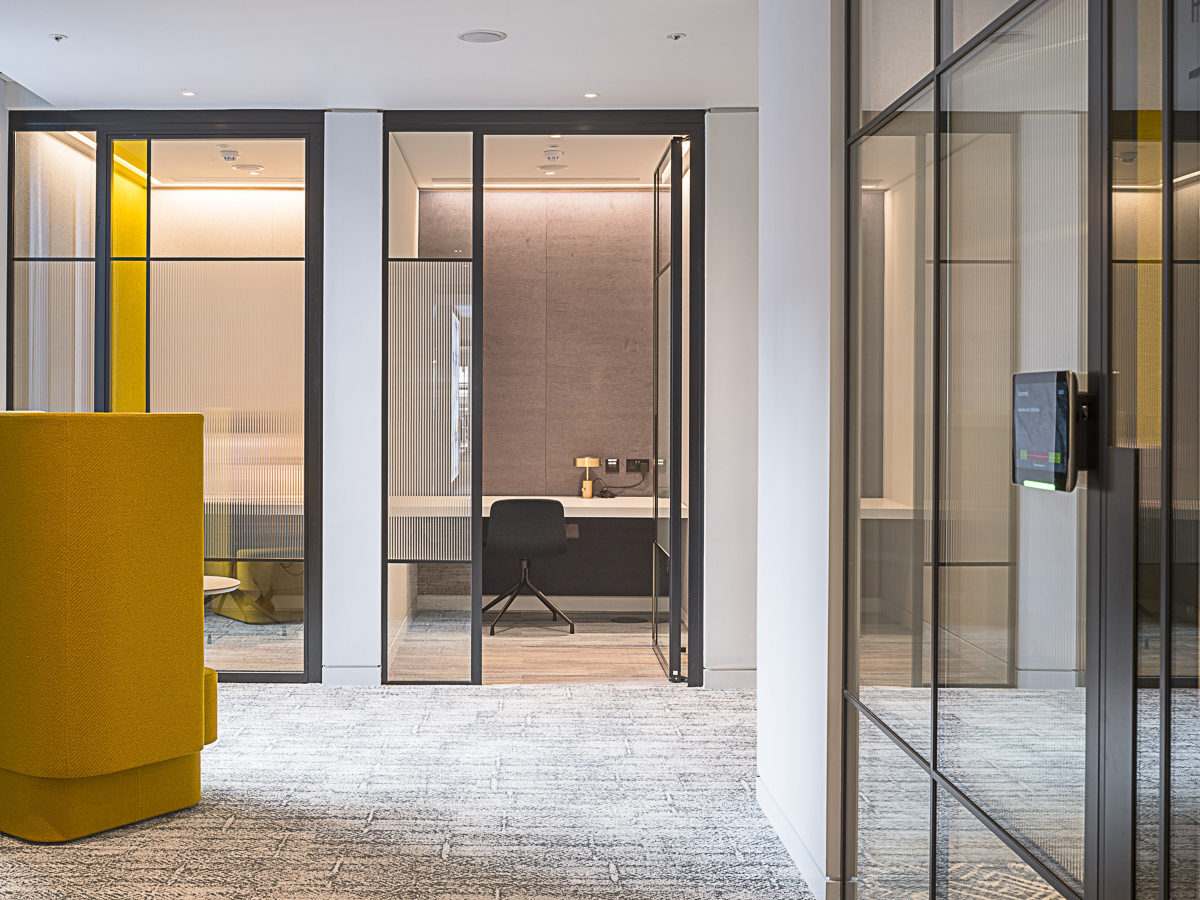 Structural Glass Wall Being Used as Office Doors